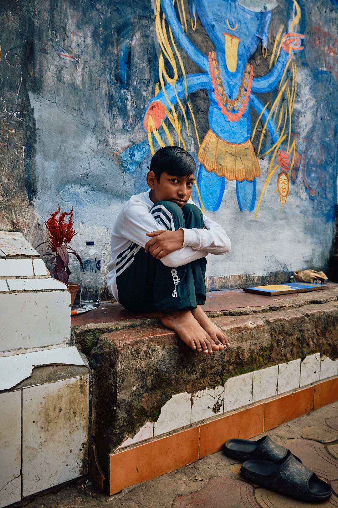 Boy Sculptor Portrait Melancholy Kolkata Street Documentary Graphic Color Contrast Kali